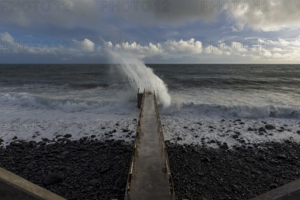 Pier during storm, bridge with waves, Atlantic Ocean, Madeira, Portugal
