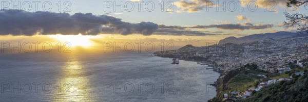 Sunset over the Atlantic Ocean, harbour with cruise ships, Funchal, Madeira, Portugal