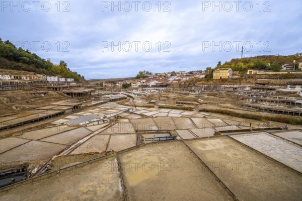 Terraced salt pans extracting and processing natural salt in the historic salt valley of anana, reflecting centuries of traditional artisanal production methods in the basque country