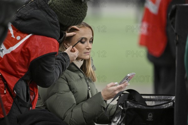 SKY presenter reporter Nele Ocik formerly Schenker with smartphone cell phone, gets makeup MHPArena, MHP Arena Stuttgart, Baden-Württemberg, Germany