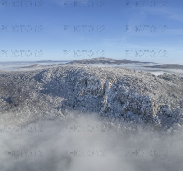 Aerial view of snowy stone walls and fog in the valley, Schwarzensee, Weissenbach an der Triesting, Lower Austria, Austria