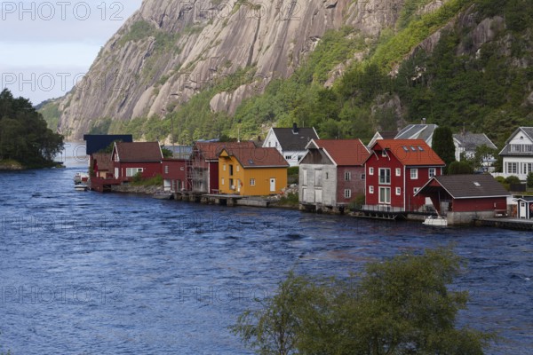 Historical wooden houses in a sleepy village by the river. Summer, Sireåna (Sireåna), Agder, Norway