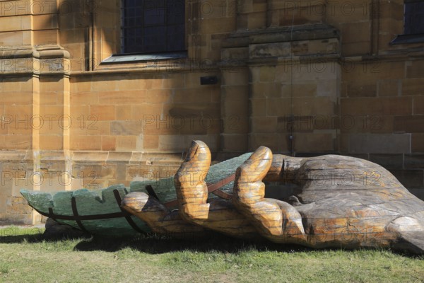 The glass ark, artists Ronald Fischer and Hubert Stern, a five metre long art object supported by a wooden hand, artists Tomas Indra and Libor Kuzdas. Here at a station in front of the Vierzehnheiligen pilgrimage church, Lichtenfels district, Upper Franconia, Bavaria, Germany (permanent work of art in public space)