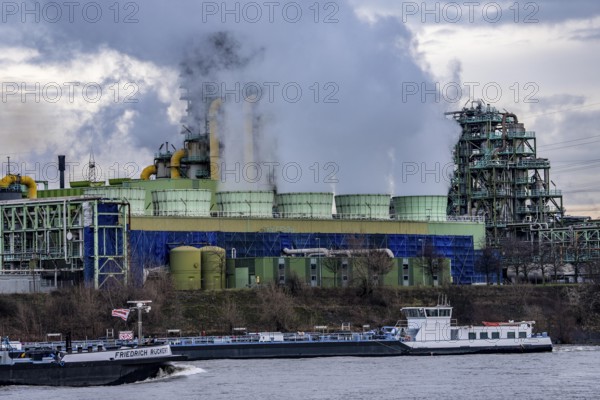 Shipping traffic on the Rhine near Duisburg-Bruckhausen, industrial setting of the ThyssenKrupp steel plant, cooler on the so-called white side of the Schwelgern coking plant, North Rhine-Westphalia, Germany