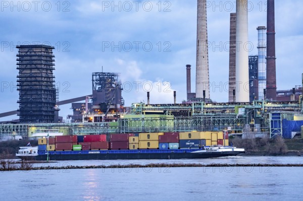 Shipping traffic on the Rhine near Duisburg-Bruckhausen, industrial setting of the ThyssenKrupp steel plant, Schwelgern coking plant, North Rhine-Westphalia, Germany