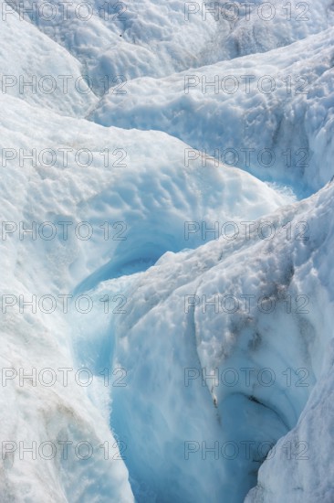 Waterfall in a crevasse on the ice of Root Glacier, Wrangell St. Elias National Park, Alaska, USA