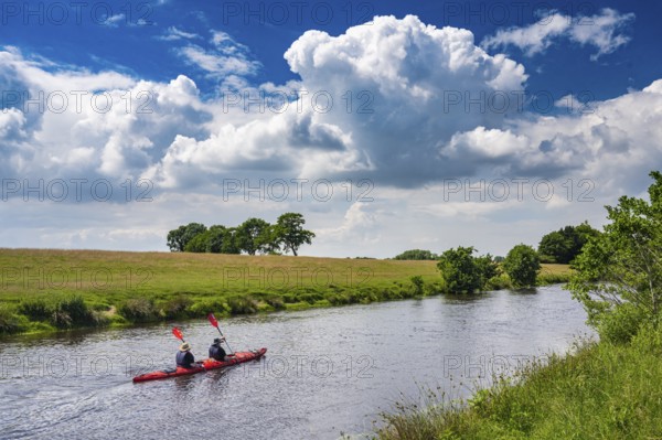 Canoeists do water sports on the Hunte near Astrup, Barneführer Holz, Wardenburg, Lower Saxony, Germany