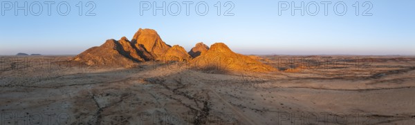 Aerial view, sunset, mountains in the desert, Spitzkoppe summit, Namib desert, Namibia