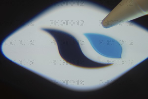 Dhaka, Bangladesh- 06 Dec 2025: Close-up of the HTX app on a screen with a stylus pointing at it