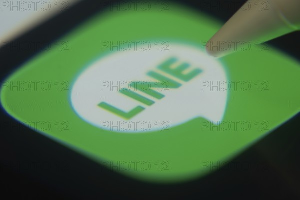 Dhaka, Bangladesh- 06 Dec 2025: Close-up of the LINE app on a screen with a stylus pointing at it