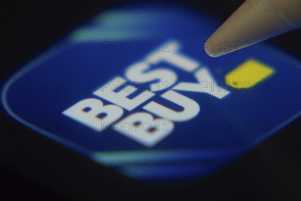 Dhaka, Bangladesh- 06 Dec 2025: Close-up of the Best Buy app on a screen with a stylus pointing at it