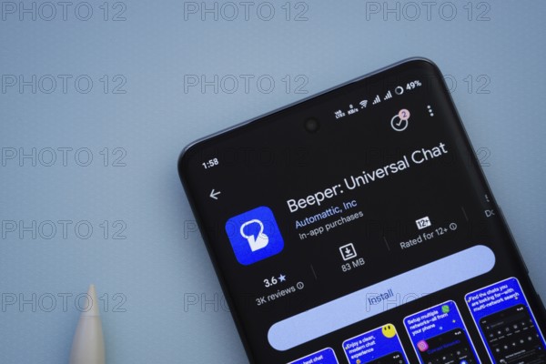 Dhaka, Bangladesh- 29 May 2025: On a blue surface, a smartphone displays the Beeper app within the Google Play Store