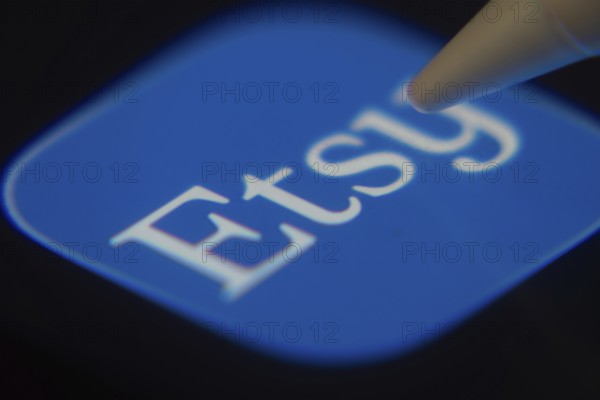 Dhaka, Bangladesh- 06 Dec 2025: Close-up of the Etsy Seller app on a screen with a stylus pointing at it