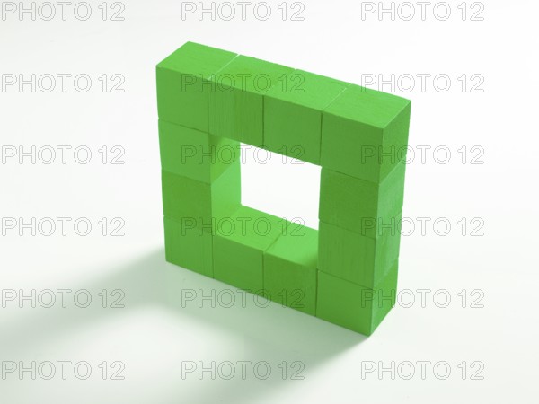 12 green wooden cubes against a white background