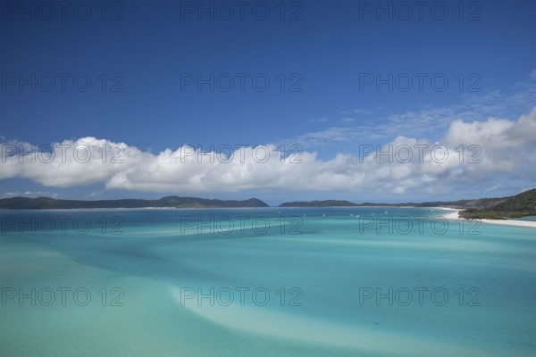 Sunny daytime view from Hill Inlet lookout over Whitehaven Beach, Whitsunday Island, Queensland, Australia