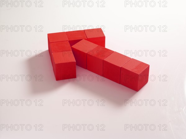 9 red wooden cubes against a white background