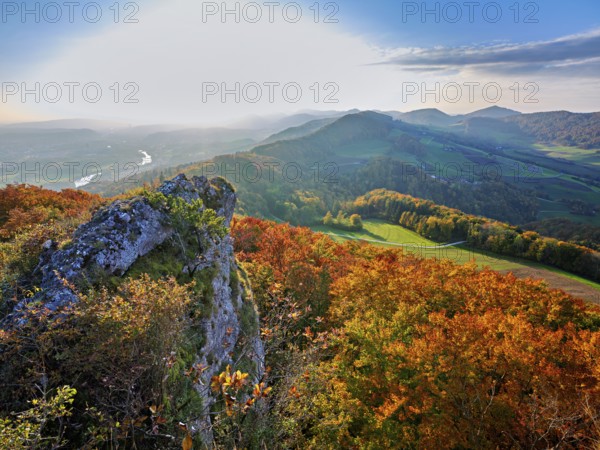 View of an autumnal forest from the Gisliflue, behind the Jura foothills with Wasserfluh and Strihen, Talheim, Canton, Aargau, Switzerland