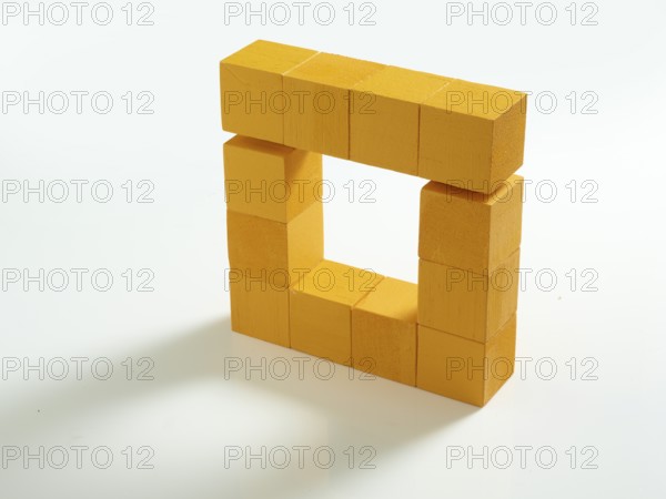 12 yellow wooden cubes against a white background