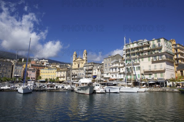 Old port with marina and church of Saint Jean-Baptiste à Bastia or church of St. John the Baptist, Port de Plaisance or Vieux Port, old town, Bastia, Haute-Corse department, Corsica, France