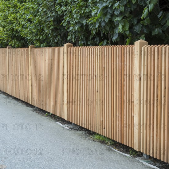 Wooden fence on the side of the road, vertical slats, town of Tegernsee, Upper Bavaria, Bavaria, Germany
