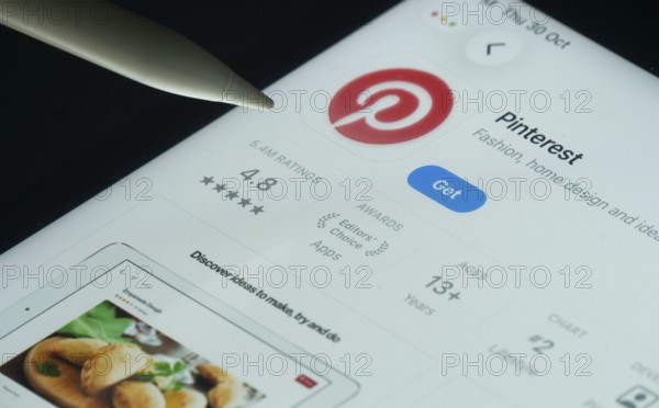 Dhaka, Bangladesh- 30 Oct 2025: Pinterest app on a iPad screen with a pen pointing at the install option