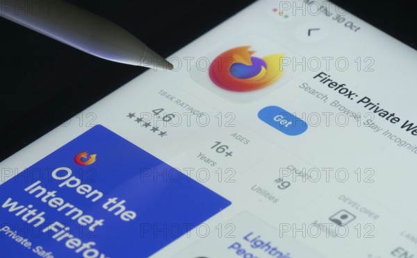 Dhaka, Bangladesh- 30 Oct 2025: Firefox app on a iPad screen with a pen pointing at the install option