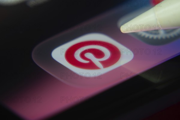 16 Nov 2025- Dhaka, Bangladesh: Stylus touching the Pinterest app icon on a smartphone screen