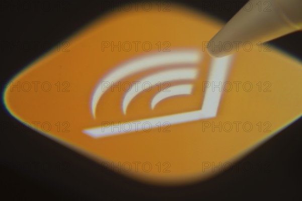 Dhaka, Bangladesh- 06 Dec 2025: Close-up of the Audible app on a screen with a stylus pointing at it