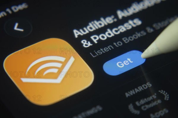 Dhaka, Bangladesh- 01 Dec 2025: A close-up of the Audible app icon in the App Store on an iPad screen