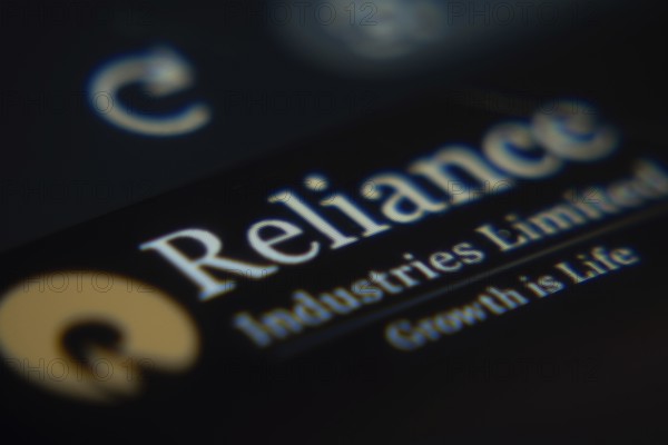 Dhaka, Bangladesh- 02 Dec 2025: A Close-up of a laptop screen is displaying the Reliance Industries web interface in a browser