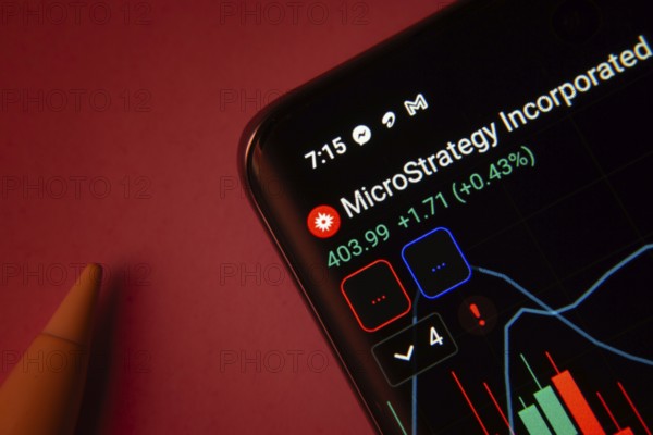 Dhaka, Bangladesh- 08 Sep 2025: Close-up of a phone screen showing MicroStrategy stock market data with a candlestick chart