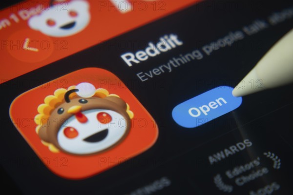 Dhaka, Bangladesh- 01 Dec 2025: A close-up of the Reddit app icon in the App Store on an iPad screen