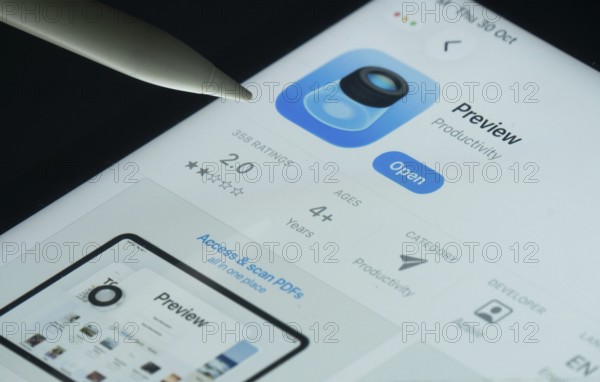 Dhaka, Bangladesh- 30 Oct 2025: Apple Preview app on a iPad screen with a pen pointing at the install option