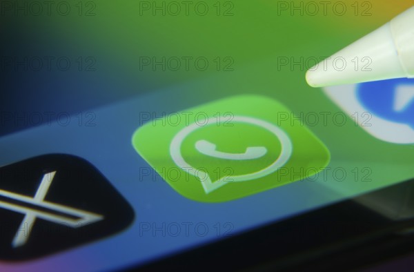 16 Nov 2025- Dhaka, Bangladesh: WhatsApp and other app icons with a digital pen on a iPad screen