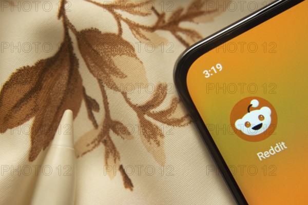 Dhaka, Bangladesh- 07 May 2025: Reddit app icon is seen on smartphone