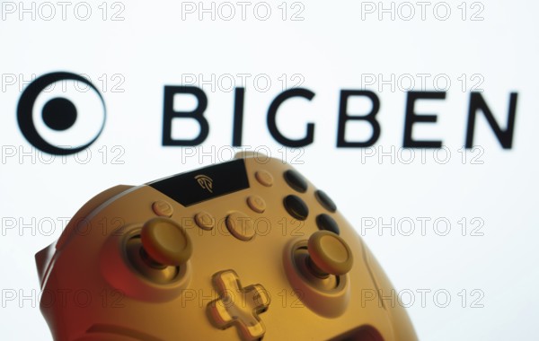 Dhaka, Bangladesh- 20 Mar 2025: A close-up of a gamepad with the Bigben Interactive seen on screen in the background