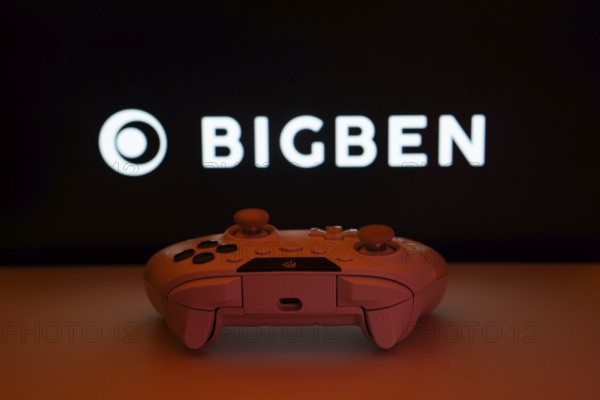 Dhaka, Bangladesh- 08 Apr 2025: A gaming controller in front of a Bigben Interactive screen