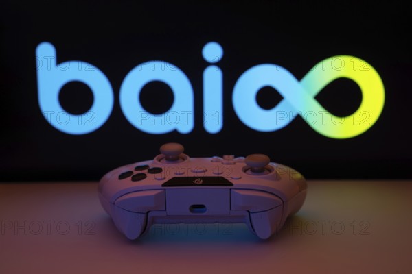 Dhaka, Bangladesh- 08 Apr 2025: A gaming controller in front of a Baioo Family Interactive Ltd screen