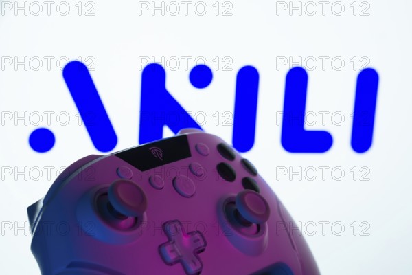 Dhaka, Bangladesh- 20 Mar 2025: A close-up of a gamepad with the Akili Interactive seen on screen in the background