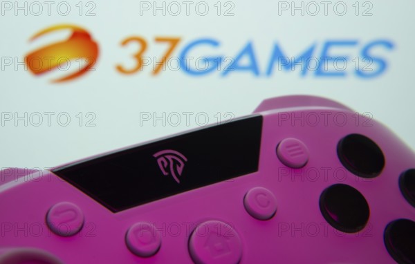 Dhaka, Bangladesh- 24 Mar 2025: A close-up of a gamepad with the 37Games seen on screen in the background