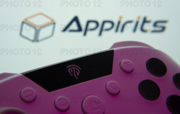 Dhaka, Bangladesh- 24 Mar 2025: A close-up of a gamepad with the Appirits seen on screen in the background