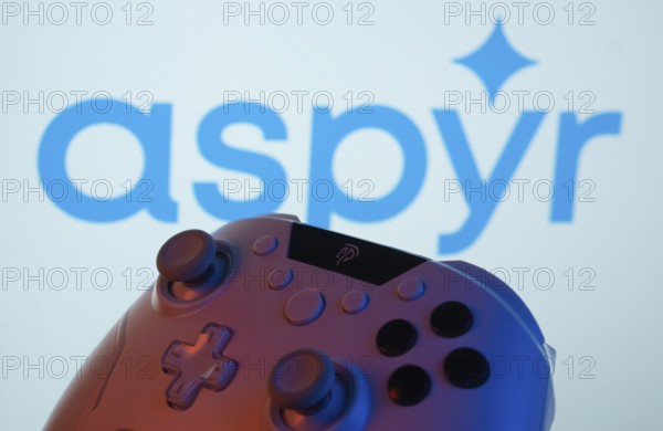 Dhaka, Bangladesh- 20 Mar 2025: A close-up of a gamepad with the Aspyr seen on screen in the background