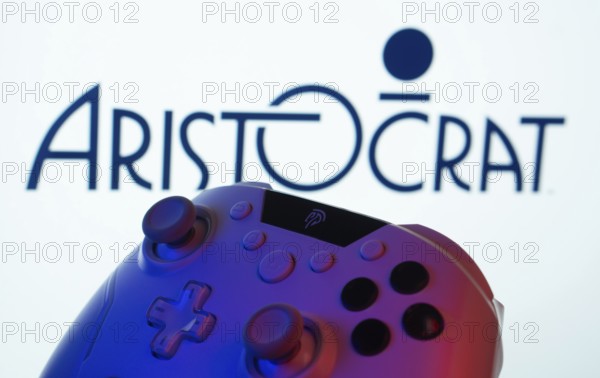 Dhaka, Bangladesh- 20 Mar 2025: A close-up of a gamepad with the Aristocrat seen on screen in the background