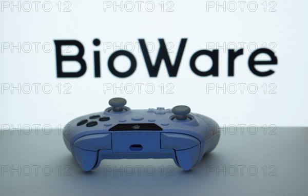 Dhaka, Bangladesh- 08 Apr 2025: A gaming controller in front of a BioWare screen