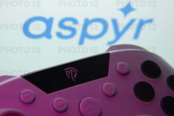 Dhaka, Bangladesh- 24 Mar 2025: A close-up of a gamepad with the Aspyr seen on screen in the background