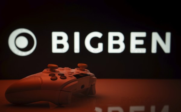 Dhaka, Bangladesh- 20 Mar 2025: A close-up of a white gamepad with the Bigben Interactive seen on screen in the background