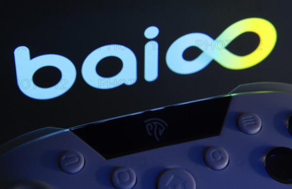 Dhaka, Bangladesh- 24 Mar 2025: A close-up of a gamepad with the Baioo Family Interactive Ltd seen on screen in the background