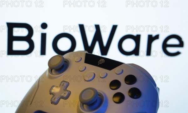Dhaka, Bangladesh- 20 Mar 2025: A close-up of a gamepad with the BioWare seen on screen in the background