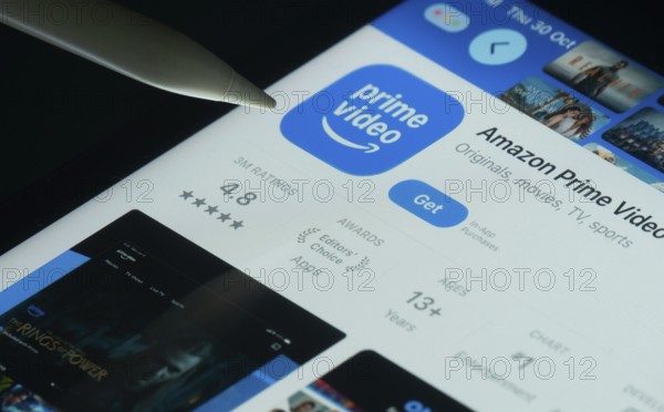 Dhaka, Bangladesh- 30 Oct 2025: Amazon Prime Video app on a iPad screen with a pen pointing at the install option