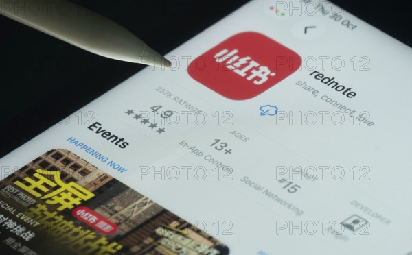 Dhaka, Bangladesh- 30 Oct 2025: rednote app on a iPad screen with a pen pointing at the install option